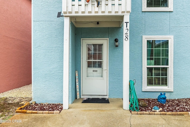 doorway to property featuring a balcony