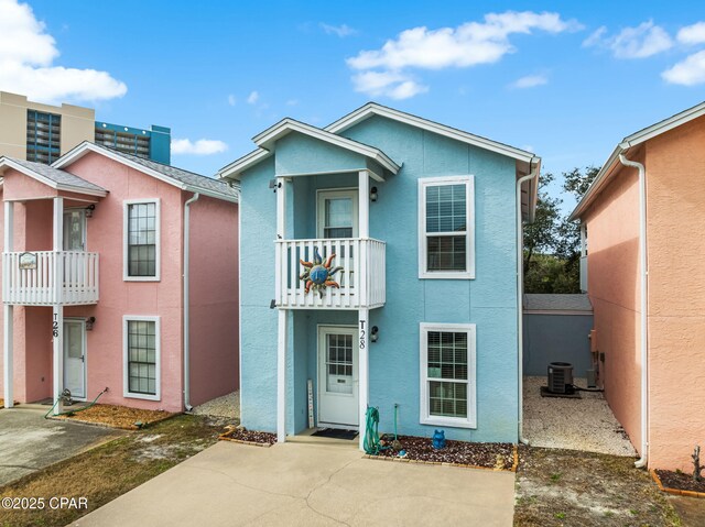 17214 Front Beach Rd Unit T28, Panama City Beach, FL 32413 - view of front facade with a balcony, stucco siding, and cooling unit
