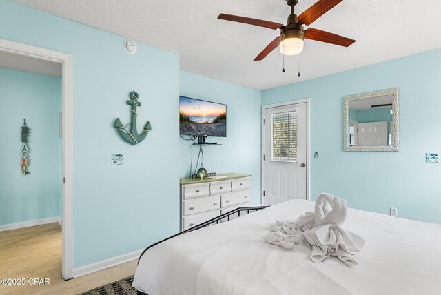 17214 Front Beach Rd Unit T28, Panama City Beach, FL 32413 - bedroom with light wood-style floors, baseboards, and ceiling fan