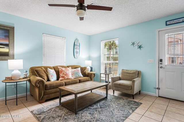 17214 Front Beach Rd Unit T28, Panama City Beach, FL 32413 - living room featuring a ceiling fan, light tile patterned floors, a chandelier, and a textured ceiling
