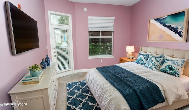 carpeted bedroom featuring access to outside