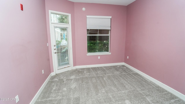 unfurnished room with light colored carpet