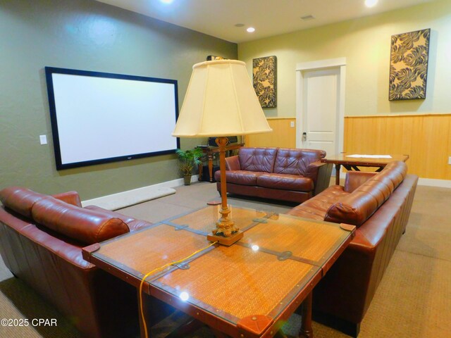 home theater room with wooden walls