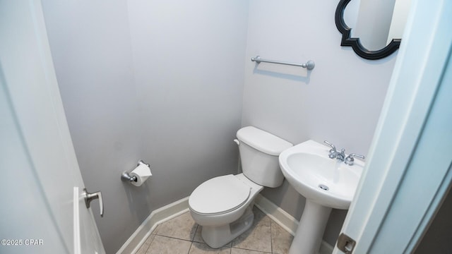 bathroom with tile patterned floors and toilet