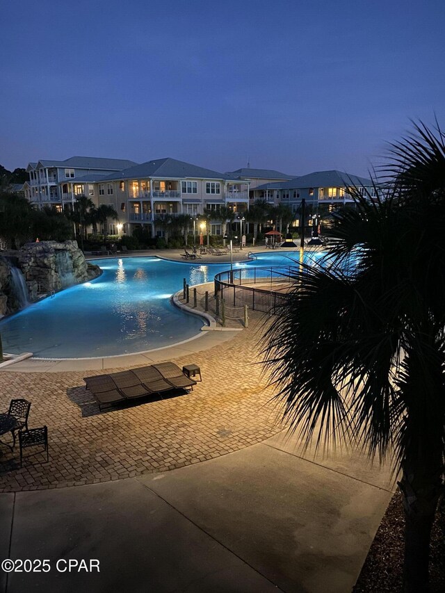 view of pool at dusk