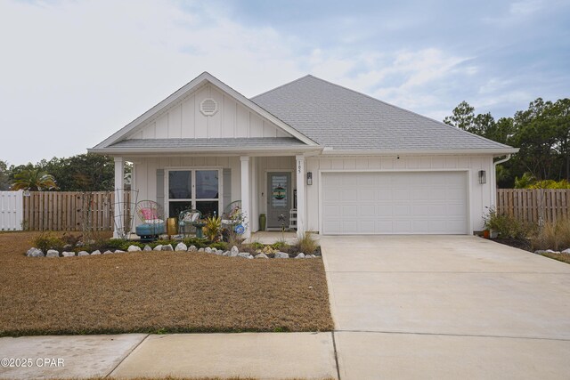 view of front of house with a garage and covered porch