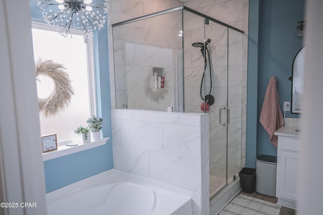 bathroom featuring a healthy amount of sunlight and independent shower and bath