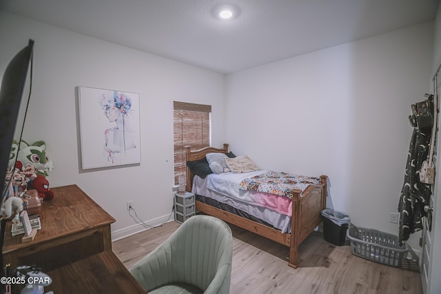 bedroom with light wood-type flooring