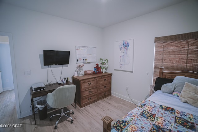 bedroom with light wood-type flooring