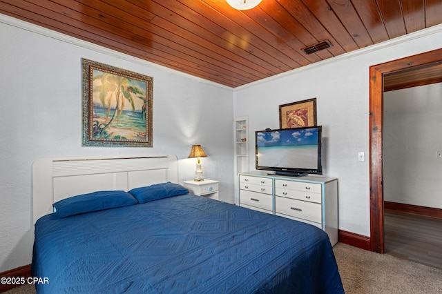 bedroom featuring wooden ceiling, visible vents, baseboards, ornamental molding, and carpet