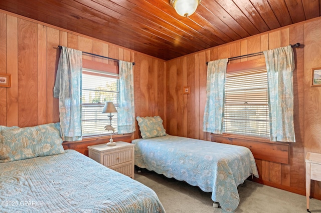 bedroom with wooden ceiling and wooden walls