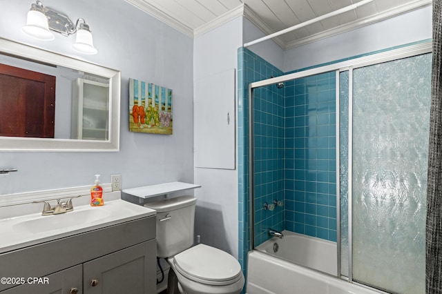 bathroom with toilet, enclosed tub / shower combo, ornamental molding, and vanity