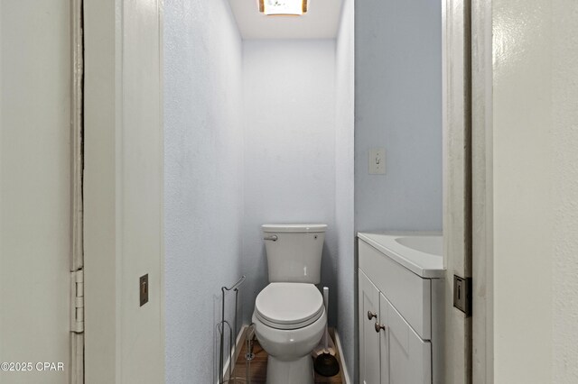 half bath with vanity and toilet