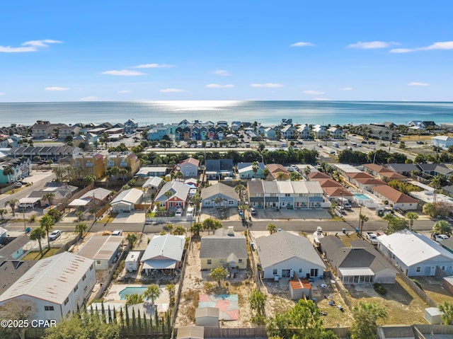 drone / aerial view with a water view and a residential view