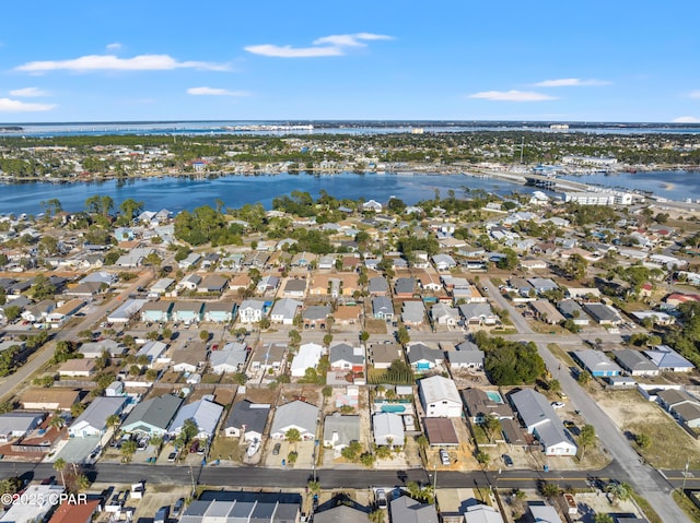 drone / aerial view with a water view and a residential view