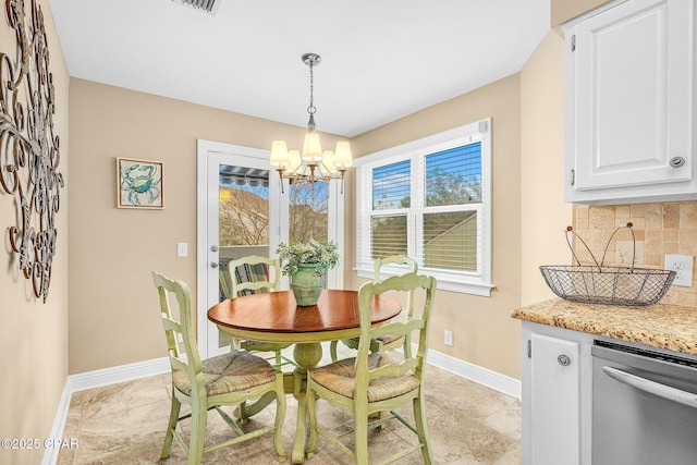 dining area with a notable chandelier