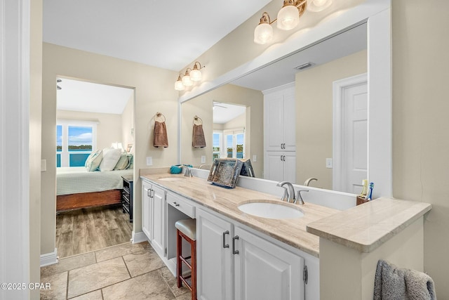 bathroom with vanity and vaulted ceiling