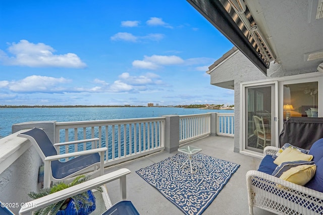 balcony featuring a water view