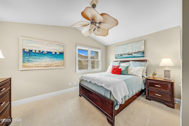 bedroom with vaulted ceiling, light colored carpet, and ceiling fan