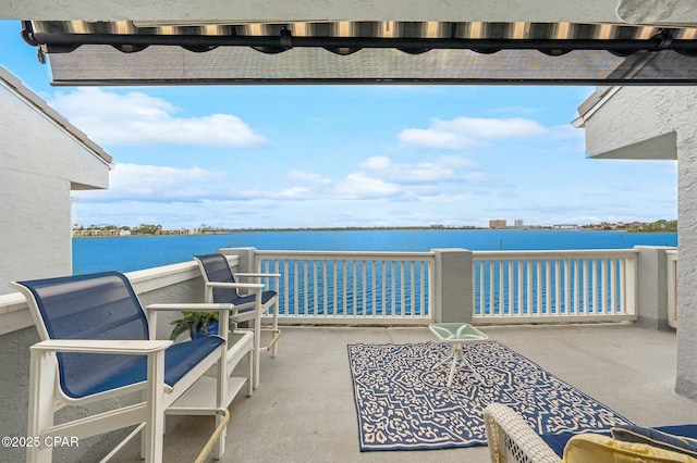 view of patio with a water view