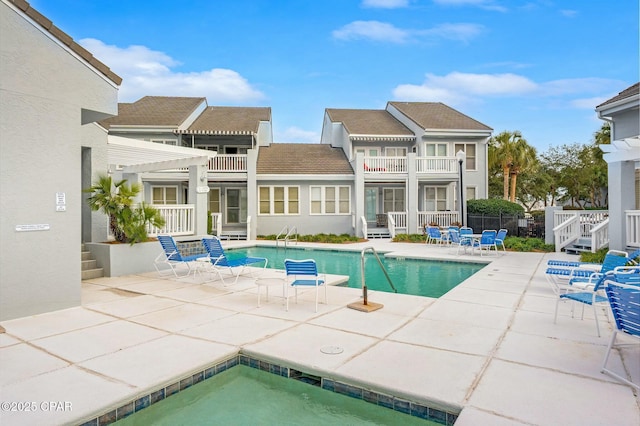 view of pool with a pergola and a patio area