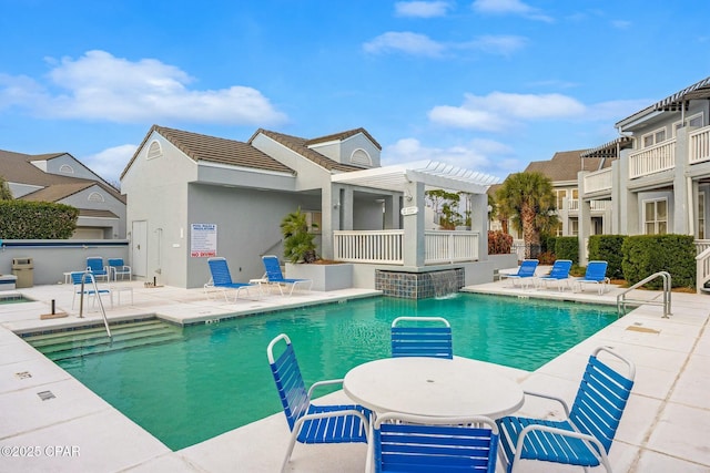 view of pool featuring a pergola, a patio, and pool water feature