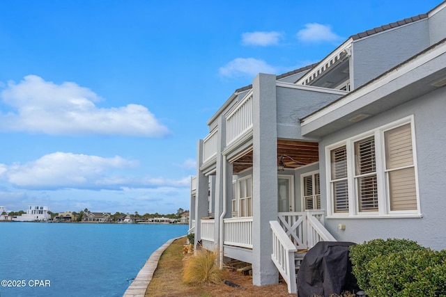 view of property exterior featuring a water view