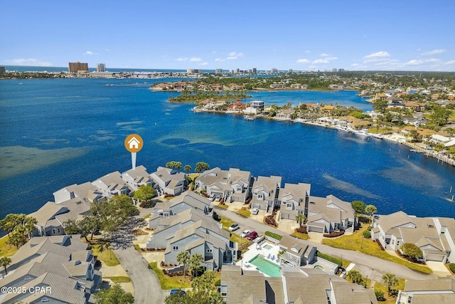 birds eye view of property with a water view