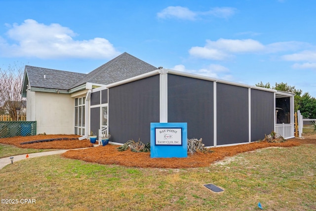 view of property exterior with a yard