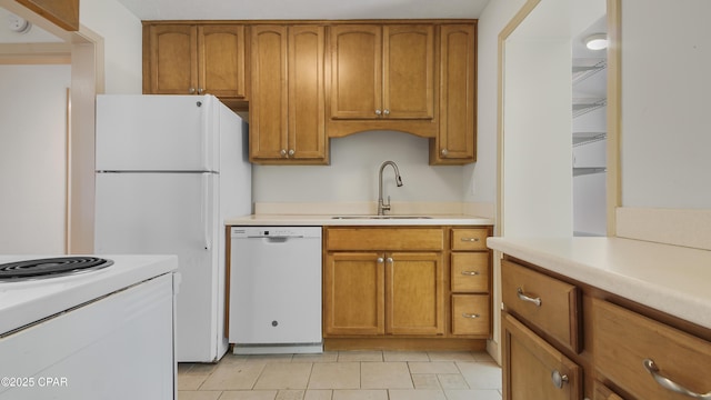 kitchen with sink and white appliances