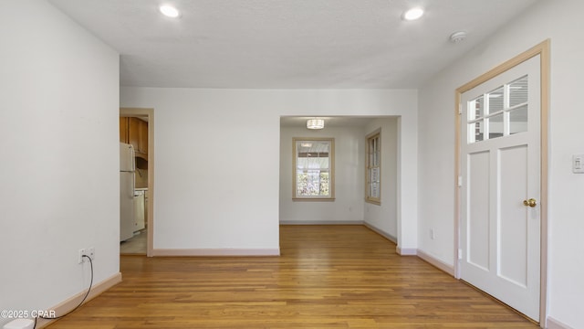 spare room featuring light wood-type flooring