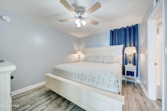 9850 S Thomas Dr Unit 806W, Panama City Beach, FL 32408 - bedroom with light wood-style floors and a ceiling fan