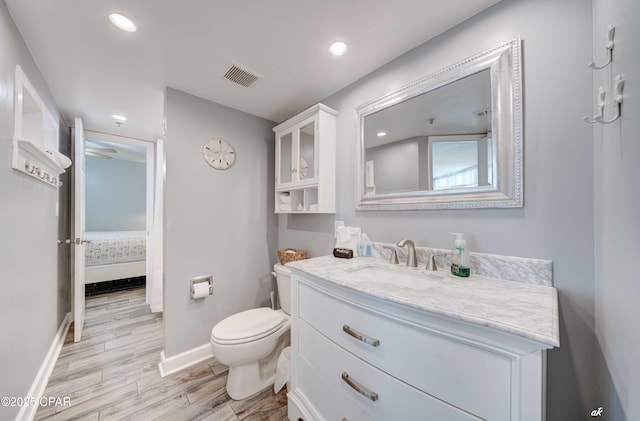 9850 S Thomas Dr Unit 806W, Panama City Beach, FL 32408 - bathroom featuring vanity, wood finished floors, and recessed lighting