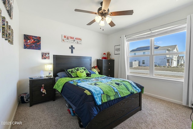 carpeted bedroom with ceiling fan