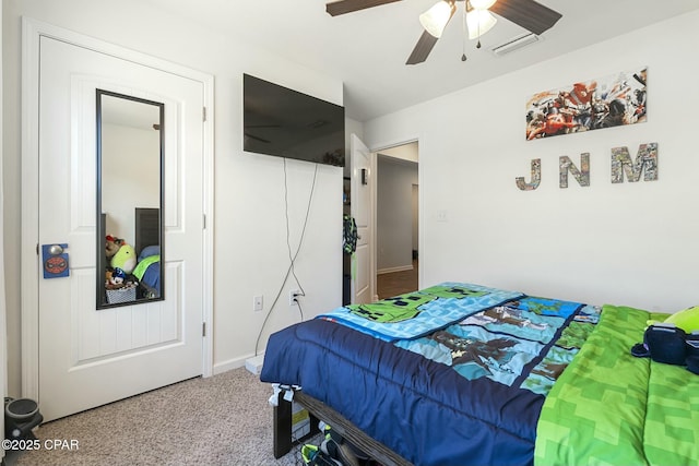 bedroom with ceiling fan and a closet