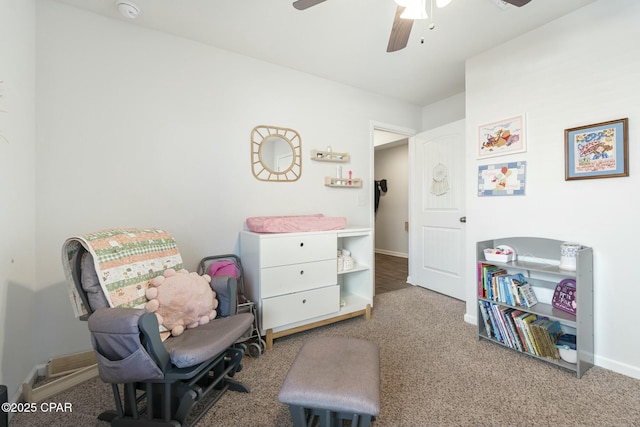 living area with carpet and ceiling fan