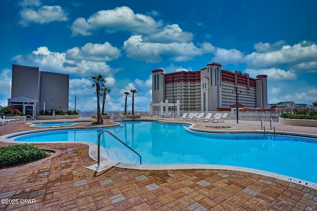 view of pool featuring a patio