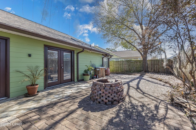 view of patio with a fire pit and french doors