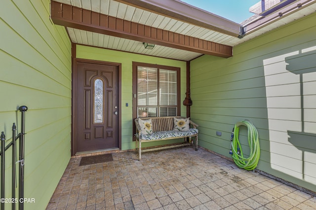 doorway to property with covered porch