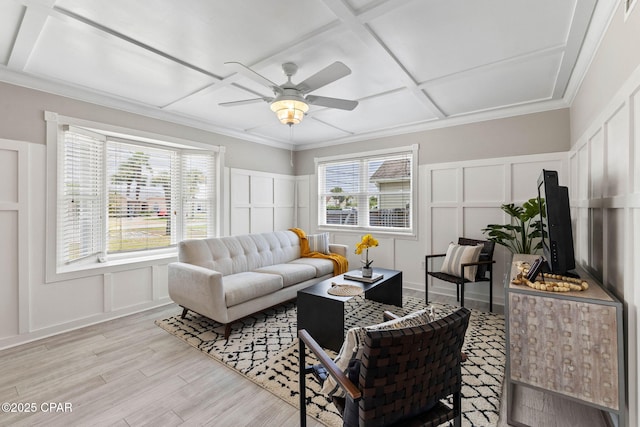 living room with coffered ceiling, a wealth of natural light, ceiling fan, and light wood-type flooring