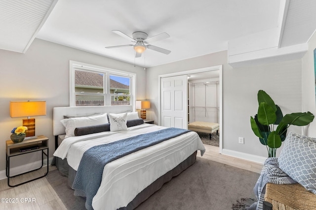 bedroom with ceiling fan and light hardwood / wood-style flooring