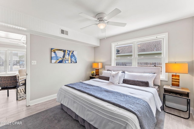 bedroom featuring hardwood / wood-style floors and ceiling fan