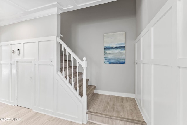 staircase with hardwood / wood-style floors