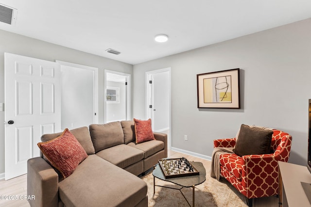 living room with light hardwood / wood-style flooring