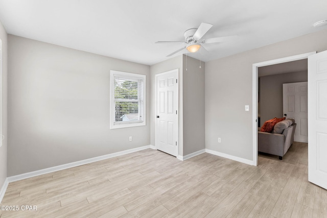 unfurnished bedroom with ceiling fan and light hardwood / wood-style floors