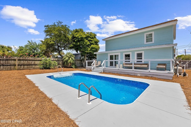 view of pool featuring a deck and a patio area