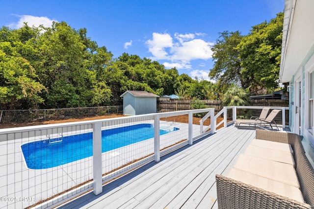 view of pool with a storage shed