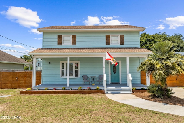 view of front of home featuring a porch and a front lawn