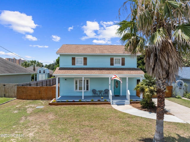 view of front of property featuring a porch and a front lawn