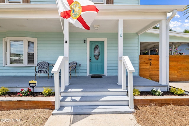 doorway to property with a porch